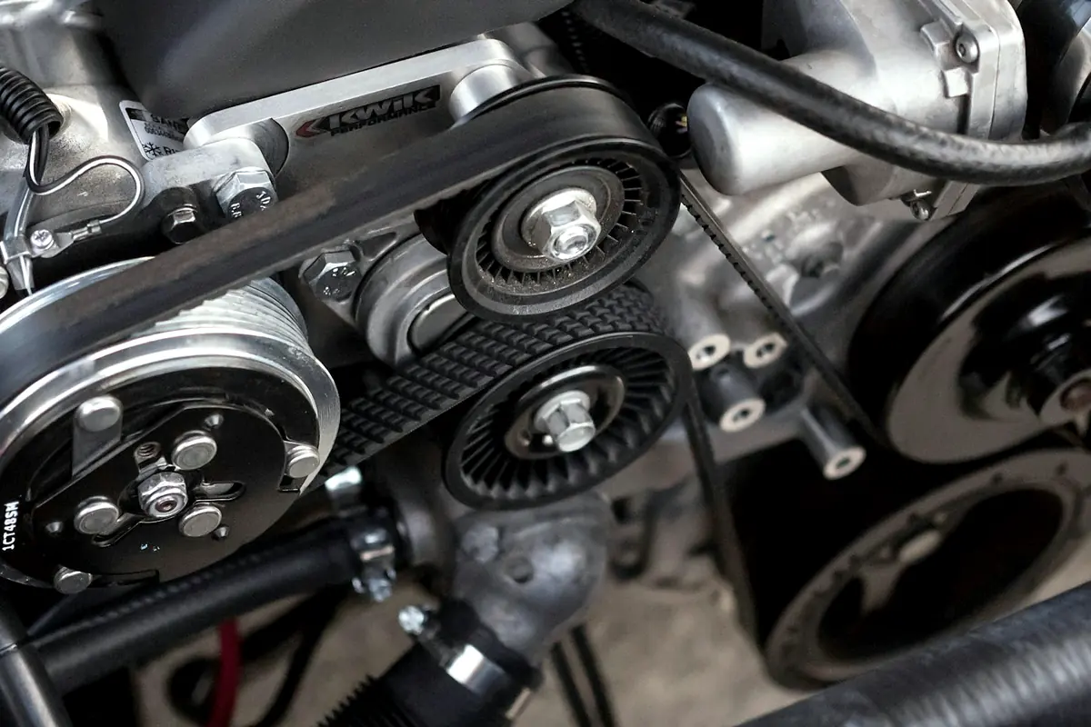 An engine accessory drive with pulleys and a serpentine belt